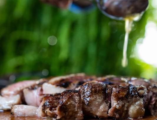 Knife cutting Churrasco meat. People enjoying socially